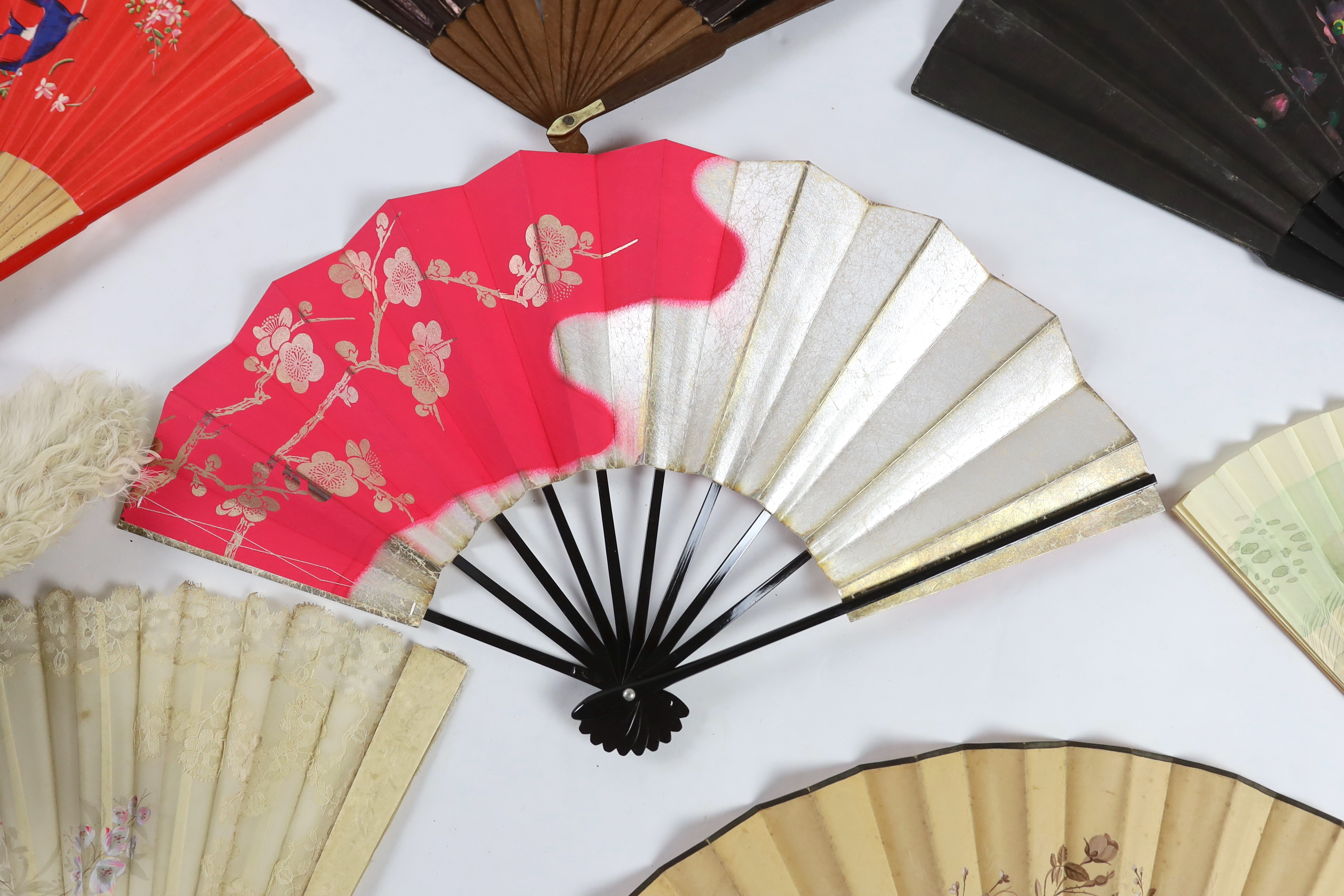 A collection of 19th and 20th century mostly paper fans, ten in reasonable condition useful for stage and film (16)